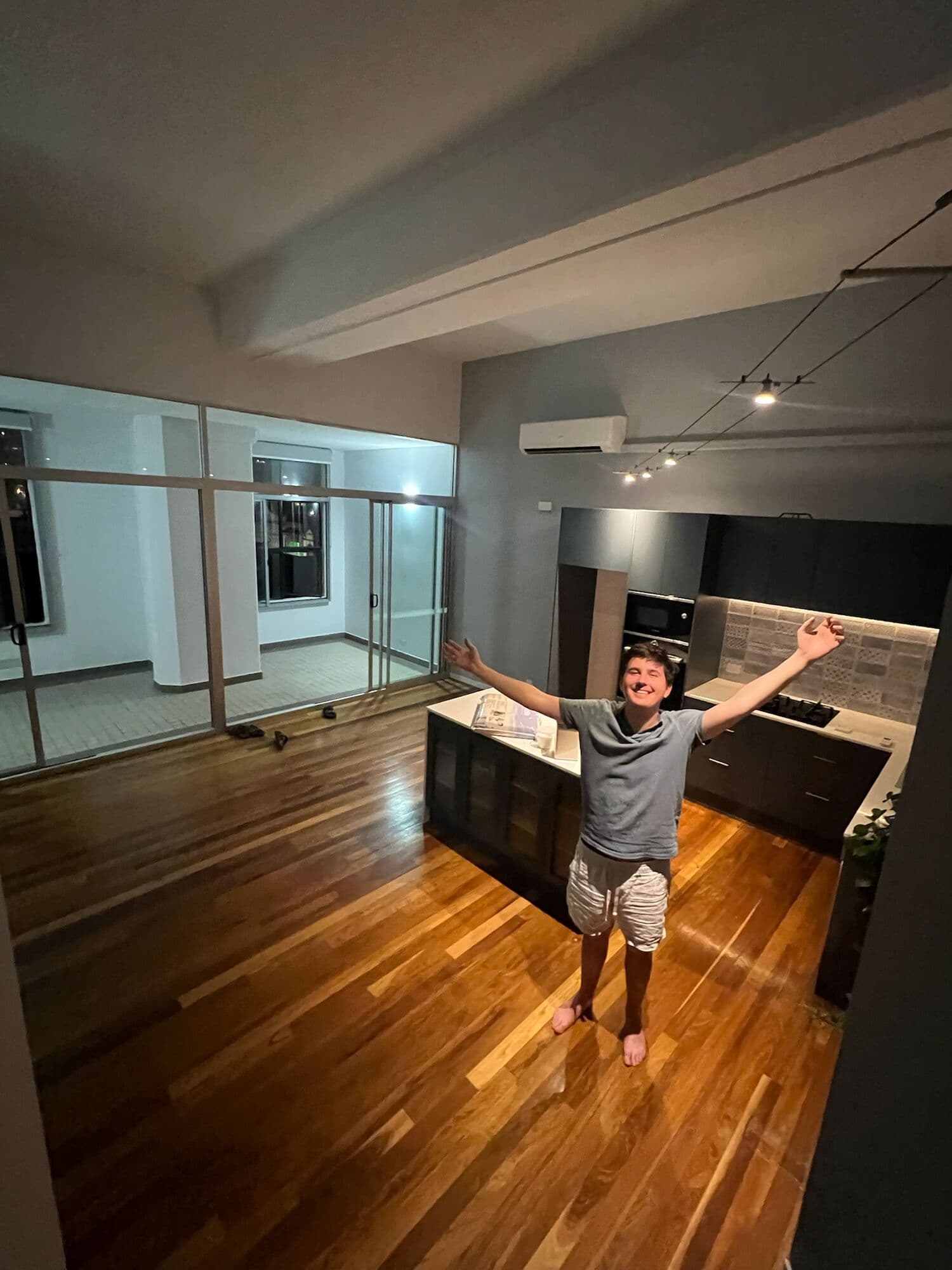 Ed standing in the apartment