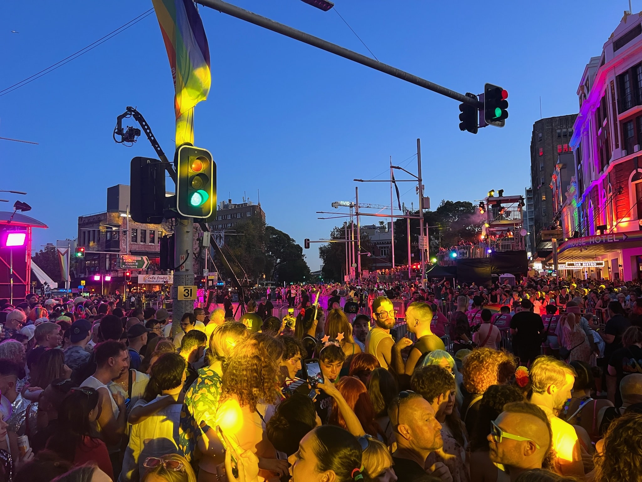 Crowded Oxford Street intersection during Mardi Gras parade