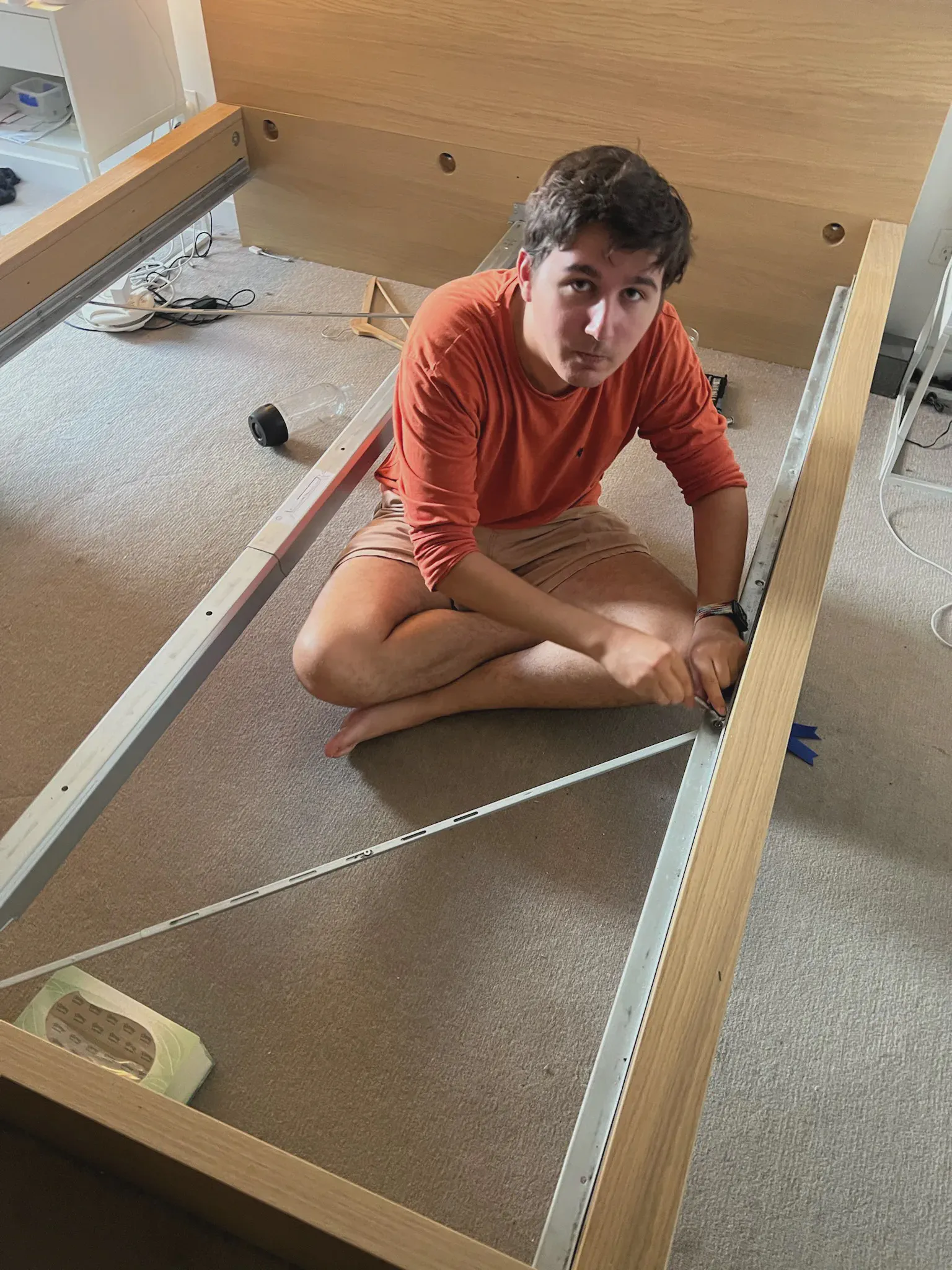 Ed constructing IKEA bed for the second time