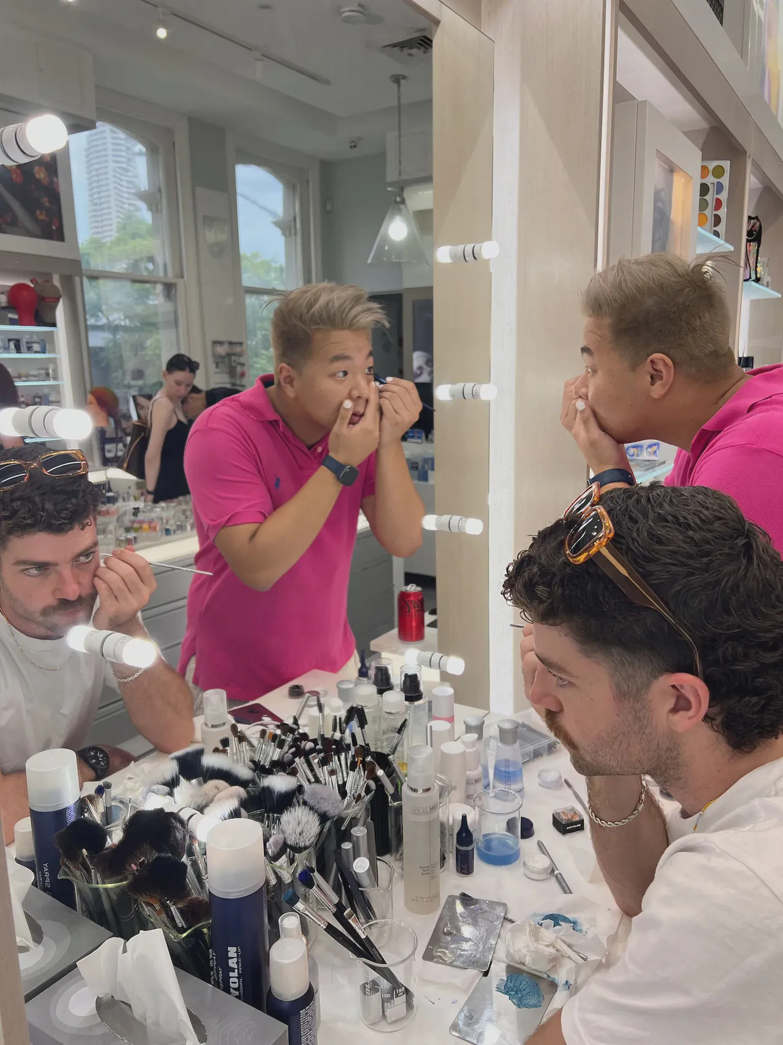 Sean and Darcy trying on eyeliner